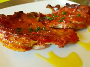 Schweinekoteletts mit Wein und Tomaten