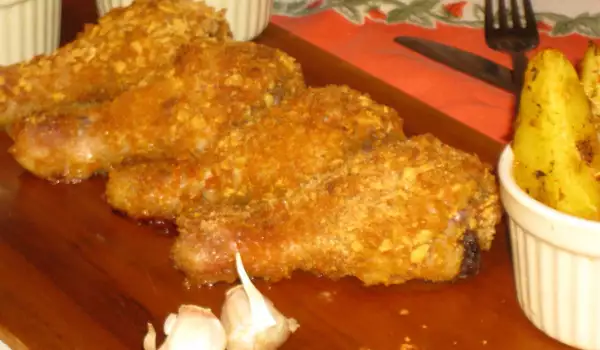Panierte Hähnchenschenkel mit Cornflakes im Ofen