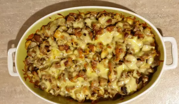 Hähnchenmägen mit Pilzen und Käse im Ofen