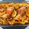 Hähnchenschenkel mit Kartoffeln, Zwiebeln und Weißwein