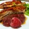 Zartes Schweinefleisch mit Himbeersoße