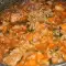 Schweinefleisch mit Reis und Tomaten